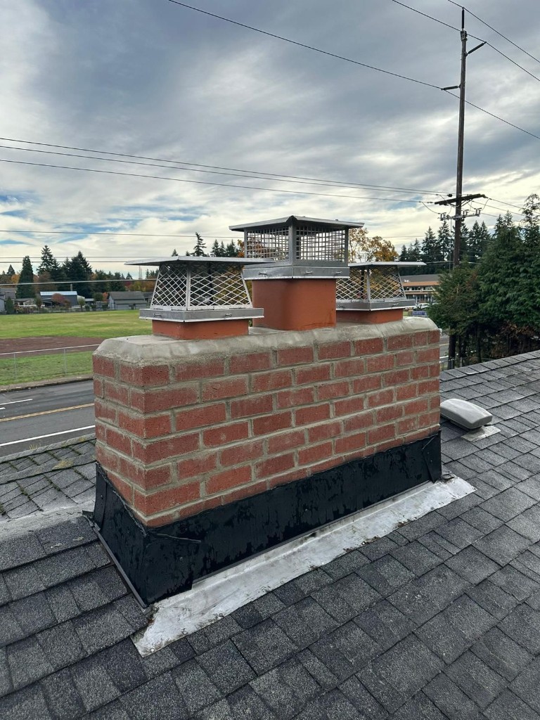 After: completed brick chimney rebuild in Portland, Oregon